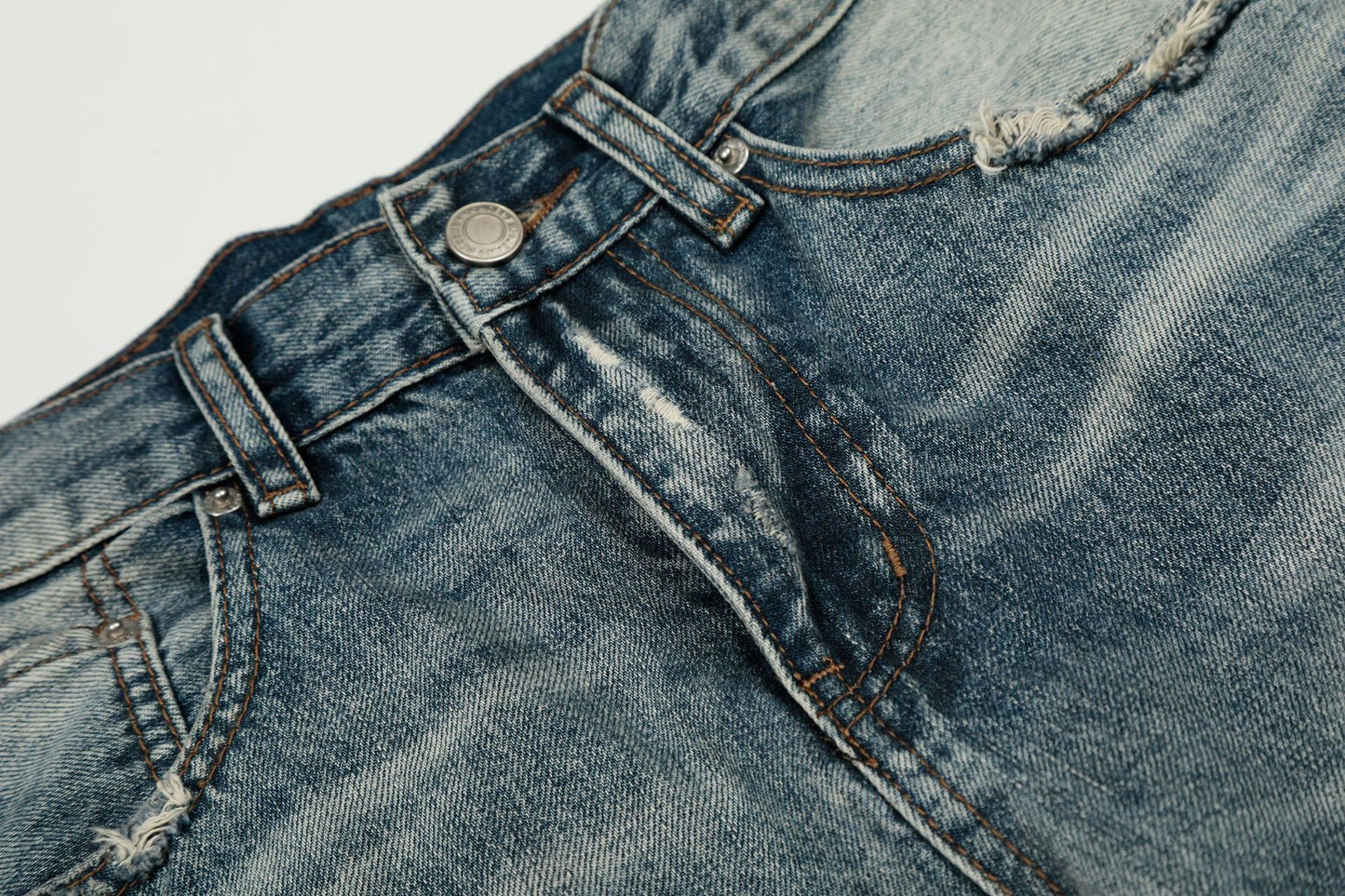 Washed Whisker Damage Curved Denim Jeans WN25863