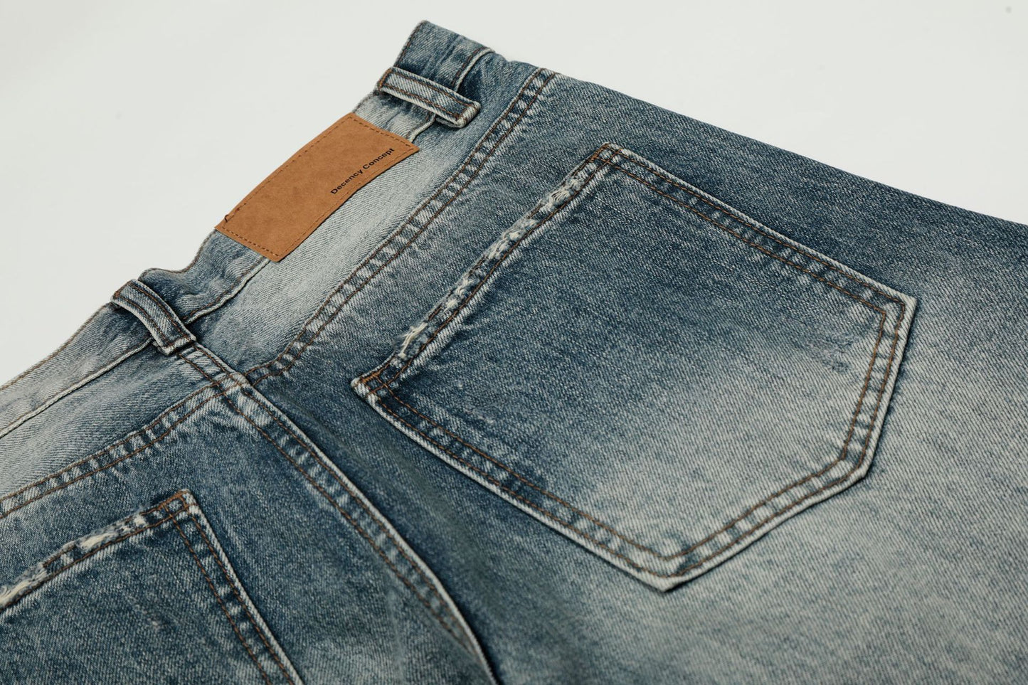 Washed Whisker Damage Curved Denim Jeans WN25863