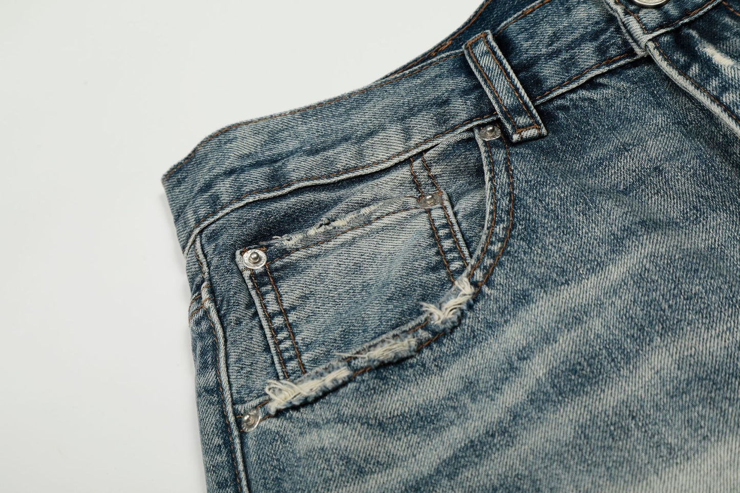 Washed Whisker Damage Curved Denim Jeans WN25863