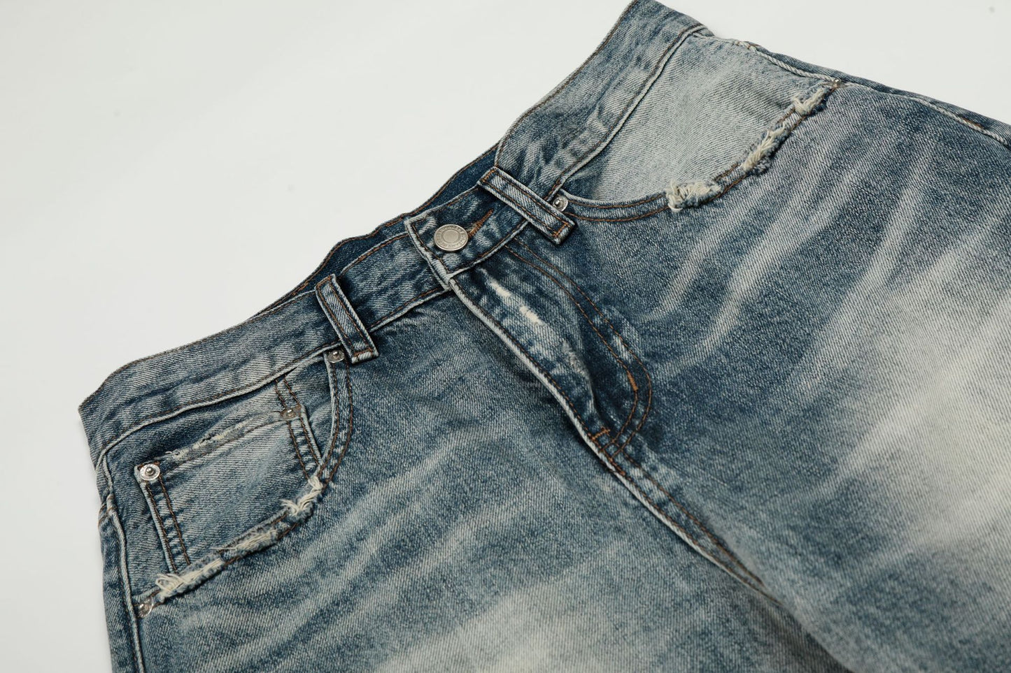 Washed Whisker Damage Curved Denim Jeans WN25863